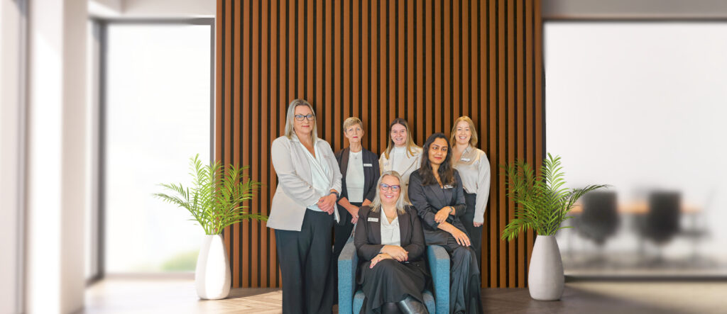 the team at regional migration Australia standing together to take a photo.