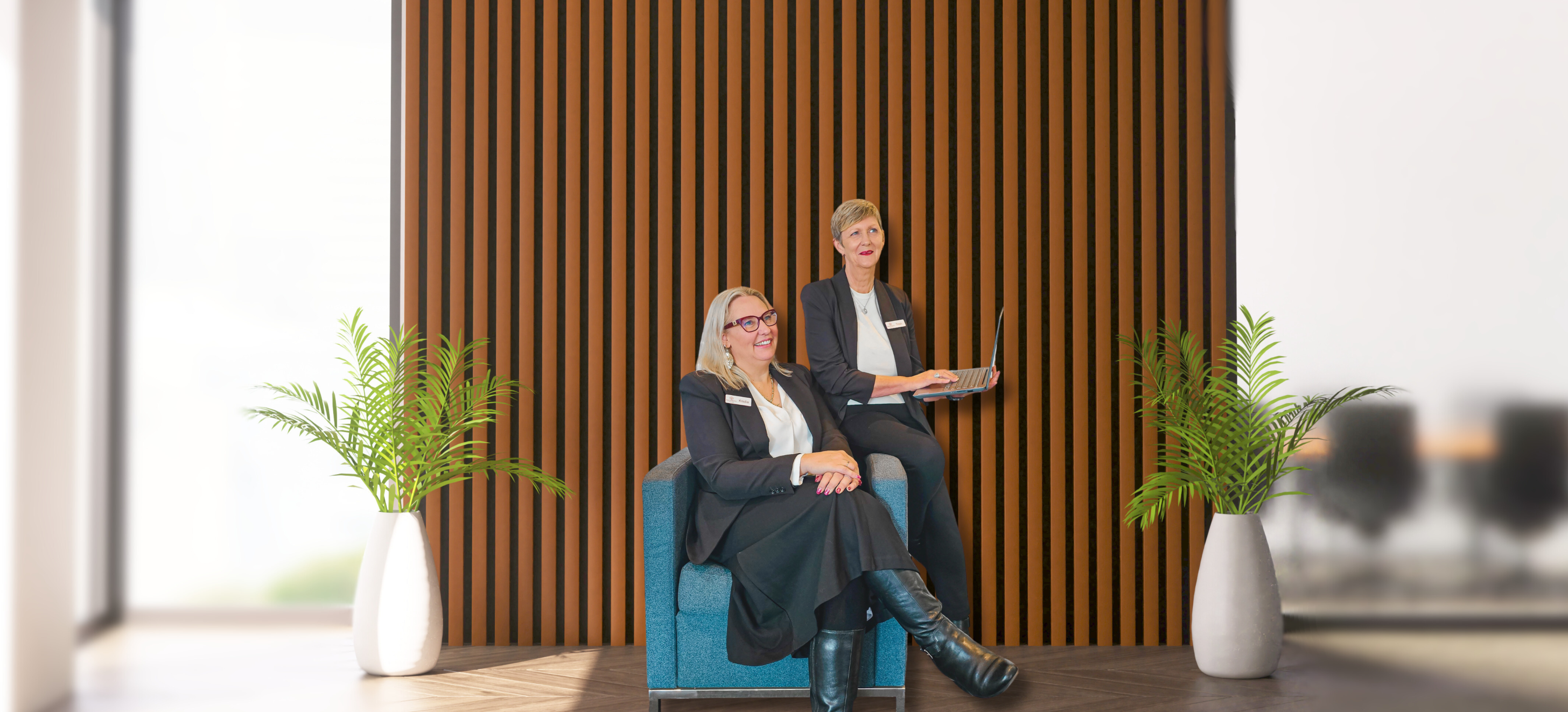 regional migration agents sitting on a chair, chatting together,