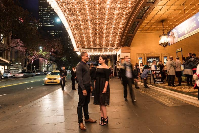 couple handing hands at night in Melbourne city